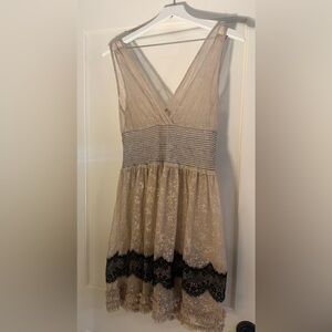 Cream and gold sheer free people dress with black lace